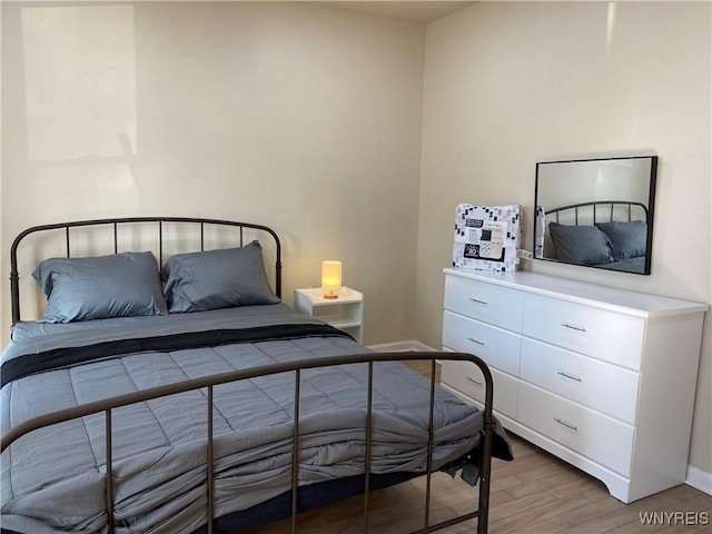 bedroom featuring wood-type flooring