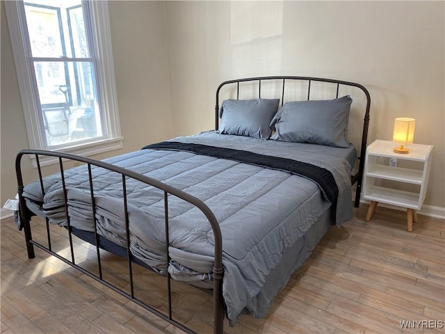 bedroom with light wood-type flooring