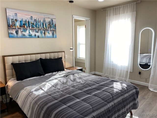 bedroom with wood-type flooring