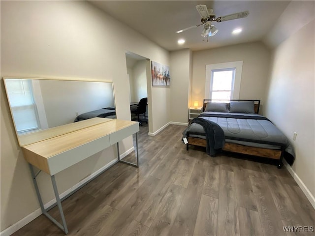 bedroom featuring vaulted ceiling, hardwood / wood-style flooring, and ceiling fan