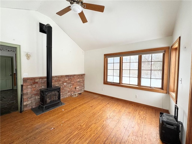 unfurnished living room with lofted ceiling, ceiling fan, and wood-type flooring