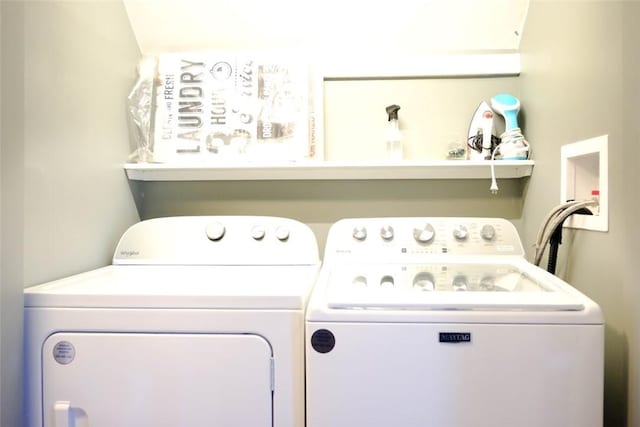 clothes washing area with washing machine and clothes dryer