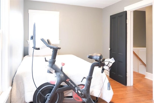 workout room featuring light wood-type flooring