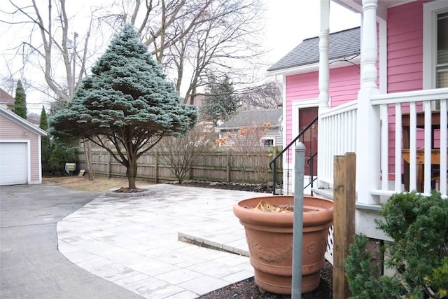 view of patio / terrace with a garage