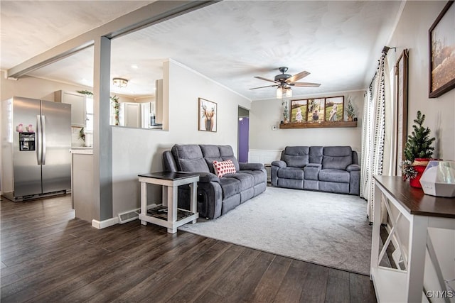 living room featuring ornamental molding, ceiling fan, and dark hardwood / wood-style flooring