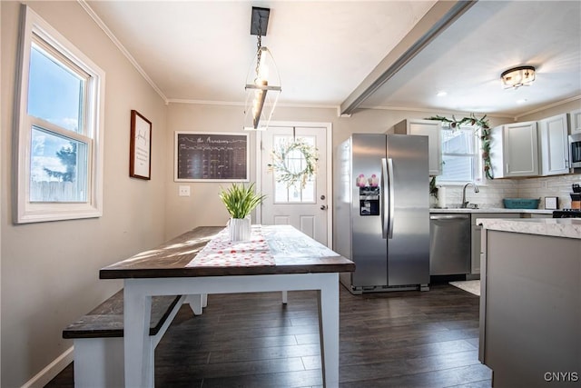 unfurnished dining area with dark wood-type flooring and ornamental molding