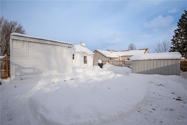 view of snow covered house