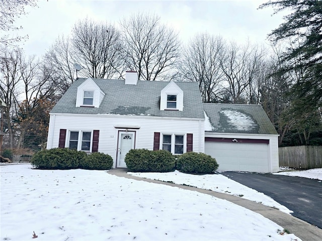 new england style home with a garage