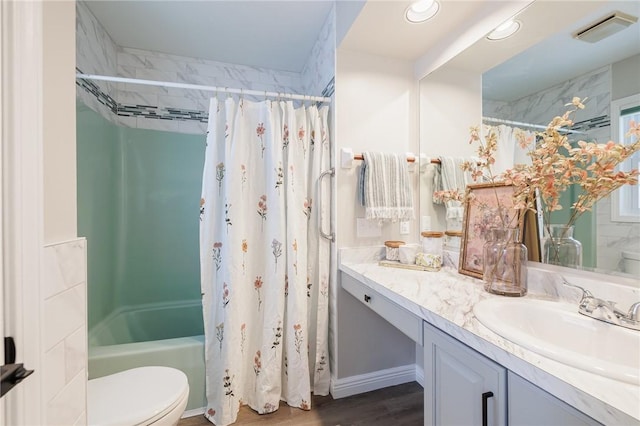 full bathroom featuring toilet, shower / tub combo, vanity, and hardwood / wood-style flooring