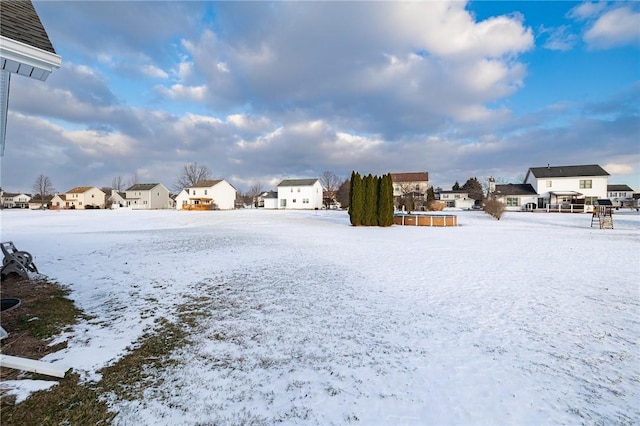 view of yard layered in snow