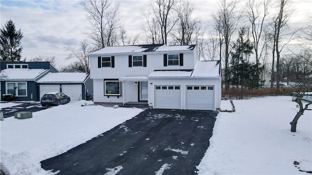 front of property with a garage