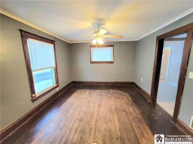 empty room featuring ornamental molding, ceiling fan, and dark hardwood / wood-style floors