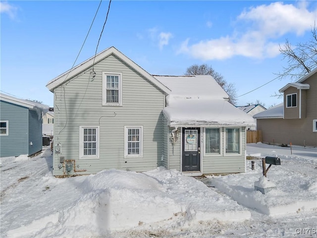 view of snow covered house