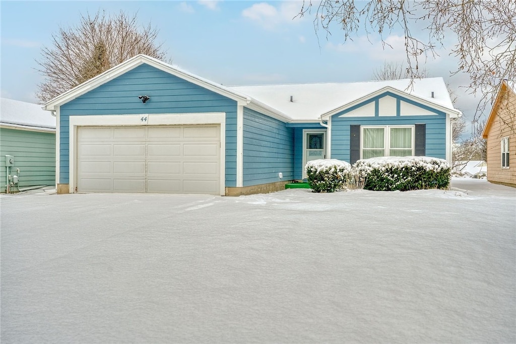 single story home with a garage