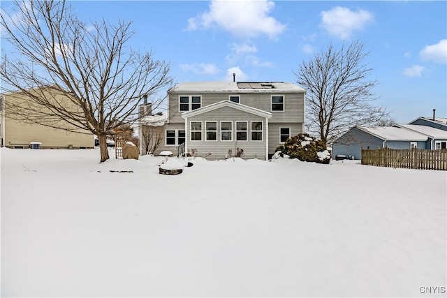 view of snow covered house