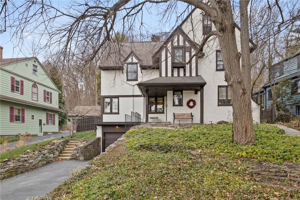 view of front of property featuring a porch and a garage