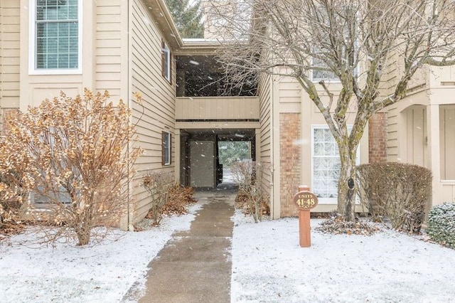 view of snow covered property entrance