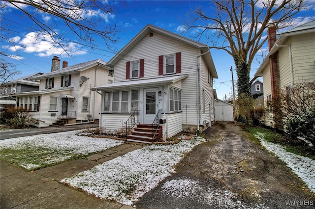 view of front of house featuring a sunroom