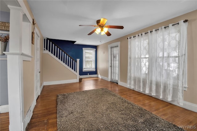 foyer with ceiling fan and dark hardwood / wood-style flooring