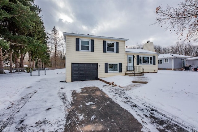 split level home featuring a garage