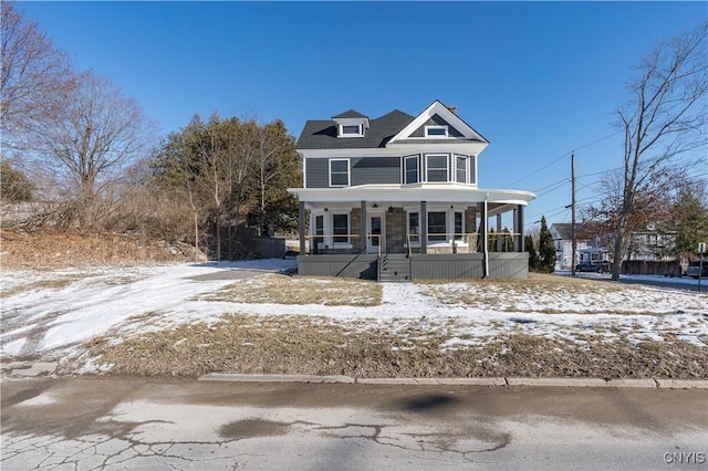 victorian home featuring covered porch