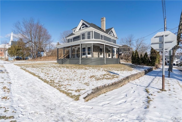 view of front of home featuring a sunroom