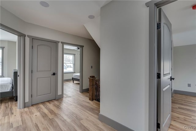 hall with light hardwood / wood-style floors