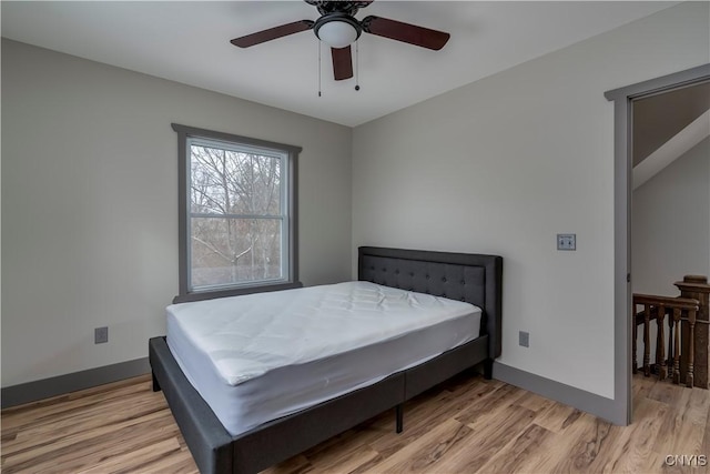 bedroom with hardwood / wood-style flooring and ceiling fan