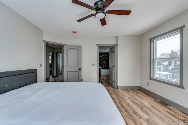 bedroom featuring ceiling fan and light wood-type flooring