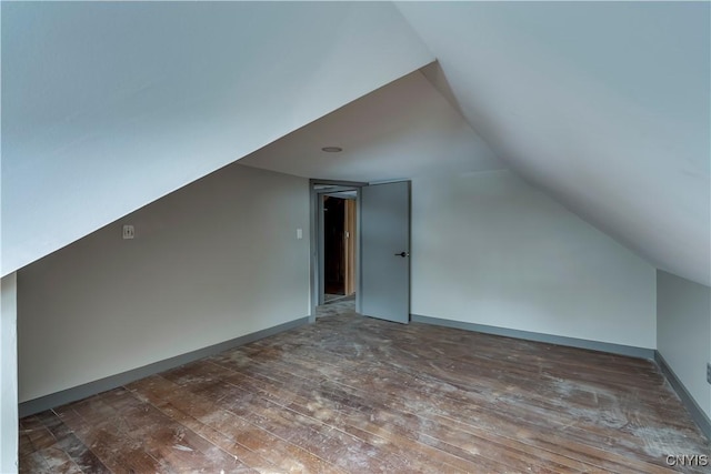 bonus room featuring lofted ceiling and hardwood / wood-style floors