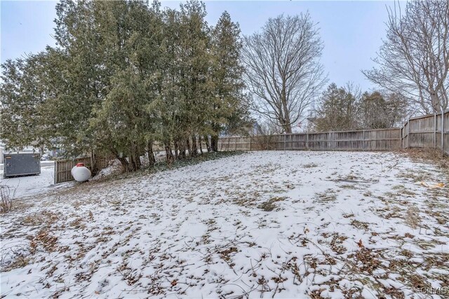 view of yard layered in snow