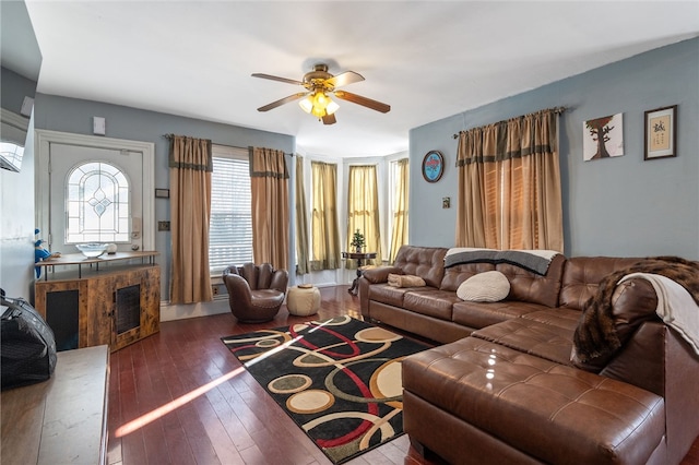 living room with ceiling fan and hardwood / wood-style floors