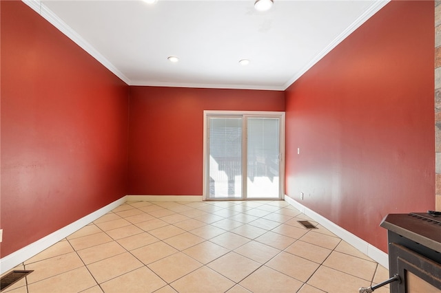 tiled spare room with ornamental molding