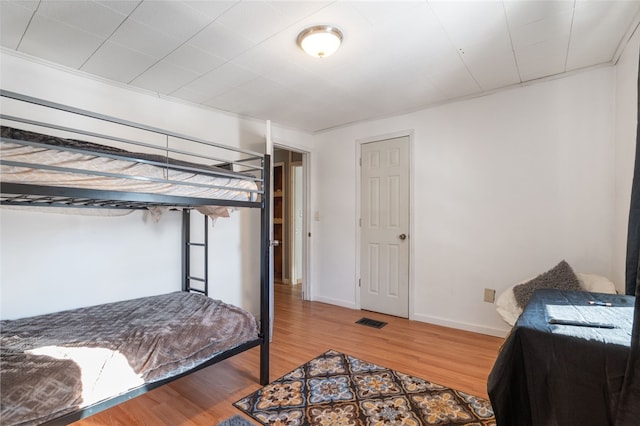 bedroom featuring hardwood / wood-style floors