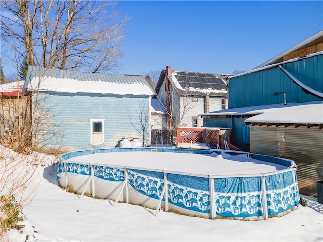 view of snow covered pool