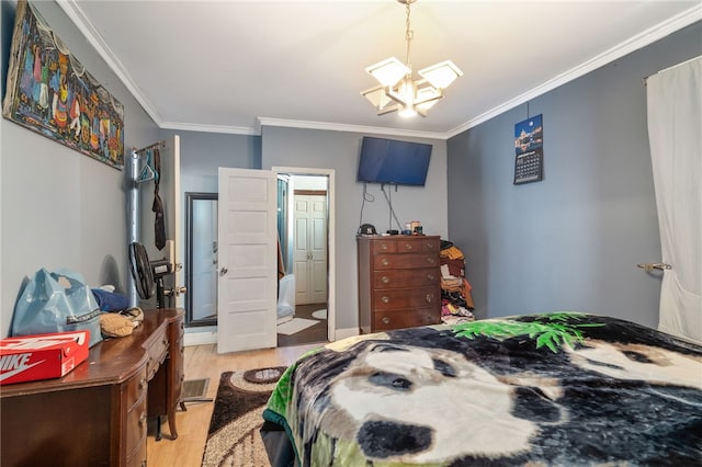 bedroom featuring a chandelier, light wood-type flooring, and ornamental molding