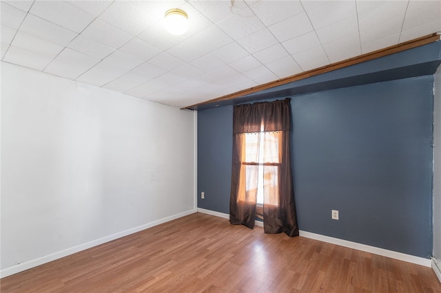 spare room featuring hardwood / wood-style flooring