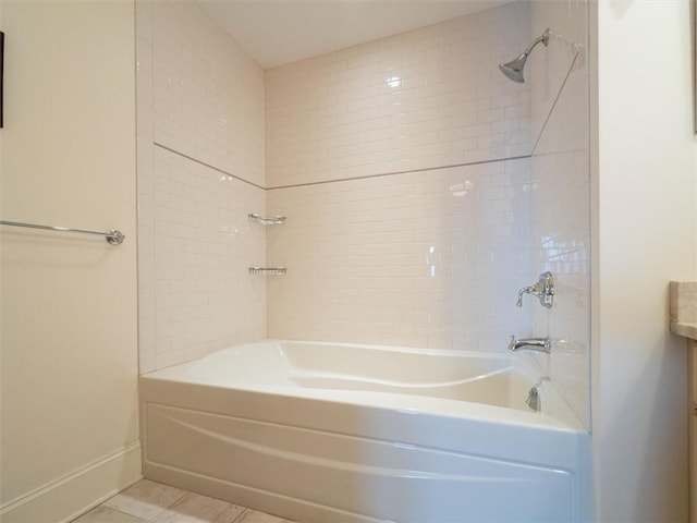 bathroom featuring vanity, tile patterned floors, and shower / tub combination