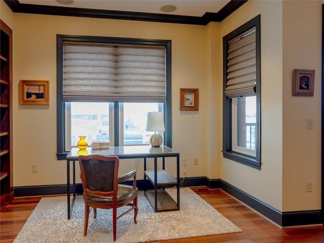 office with wood-type flooring and ornamental molding