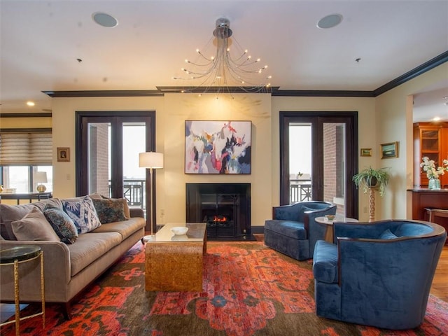 living room featuring french doors, crown molding, and wood-type flooring