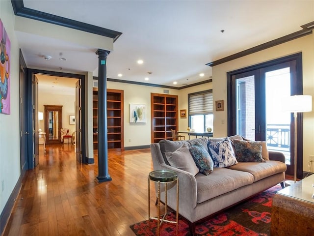 living room featuring ornamental molding, french doors, and hardwood / wood-style floors