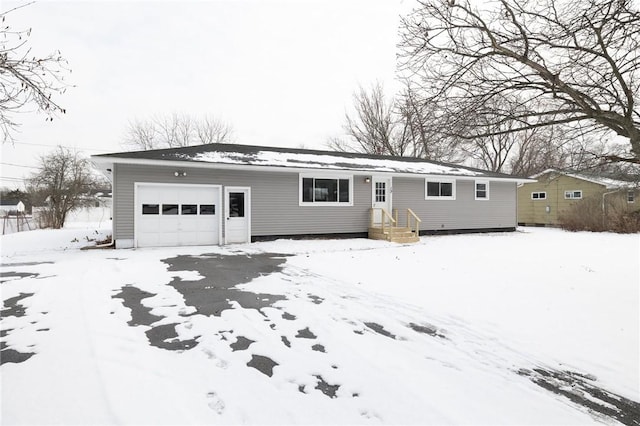 ranch-style home featuring a garage