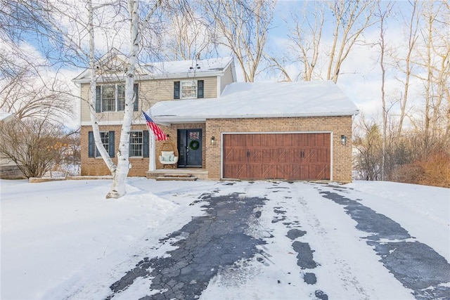 front of property with a garage