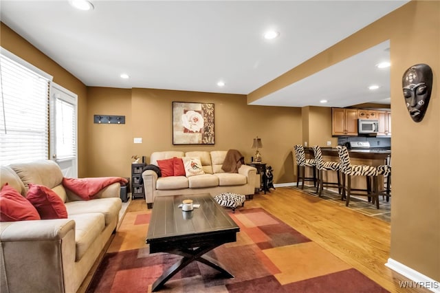 living room with light hardwood / wood-style flooring