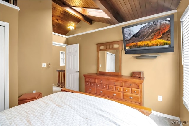 bedroom featuring lofted ceiling with skylight, wooden ceiling, and multiple windows