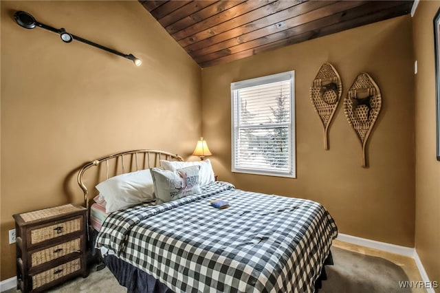 bedroom with carpet flooring, vaulted ceiling, and wood ceiling