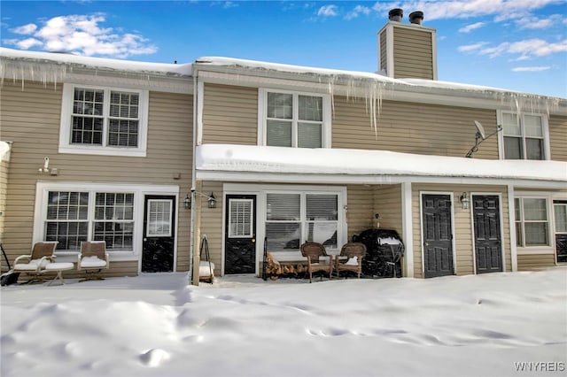 view of snow covered property