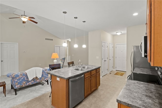 kitchen featuring sink, ceiling fan, a center island with sink, pendant lighting, and appliances with stainless steel finishes