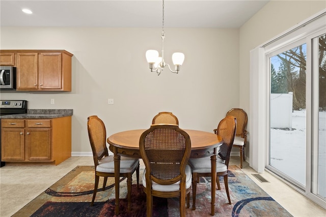 dining area with a chandelier