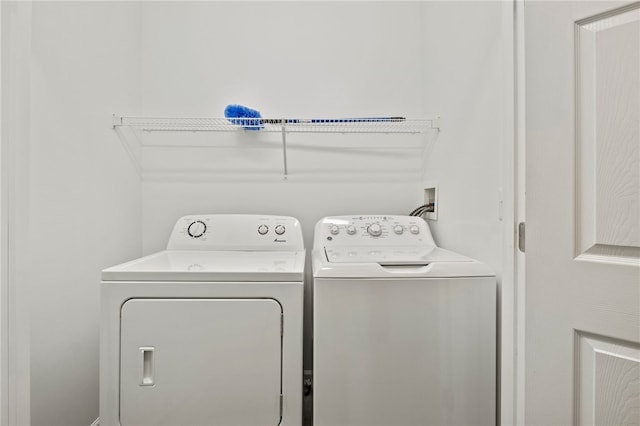 laundry area with separate washer and dryer